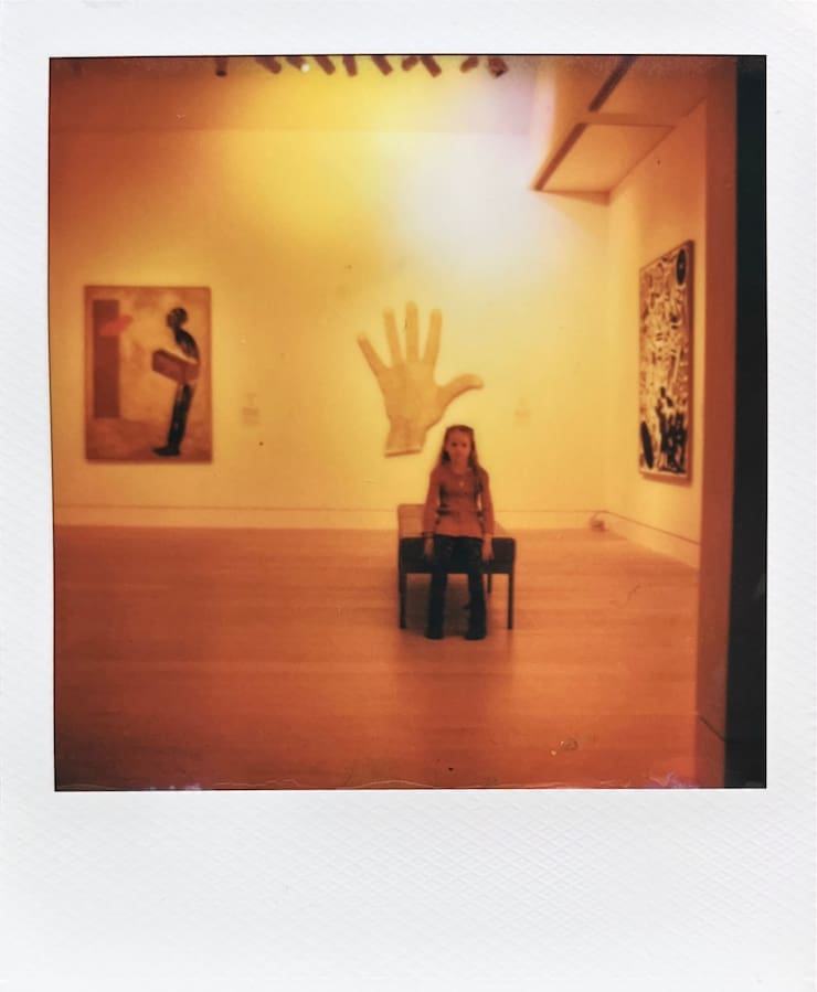 A child sitting along in a museum.
