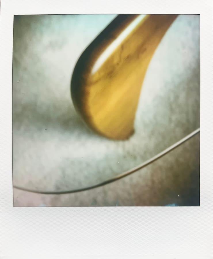 An abstract photo with a glass surface on a wooden stand.