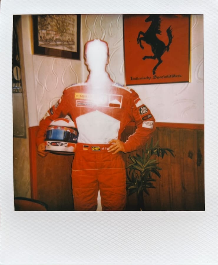 A life-sized cutout of Michael Schumacher. The face is pure
      white, because of the reflection of the camera's flash.