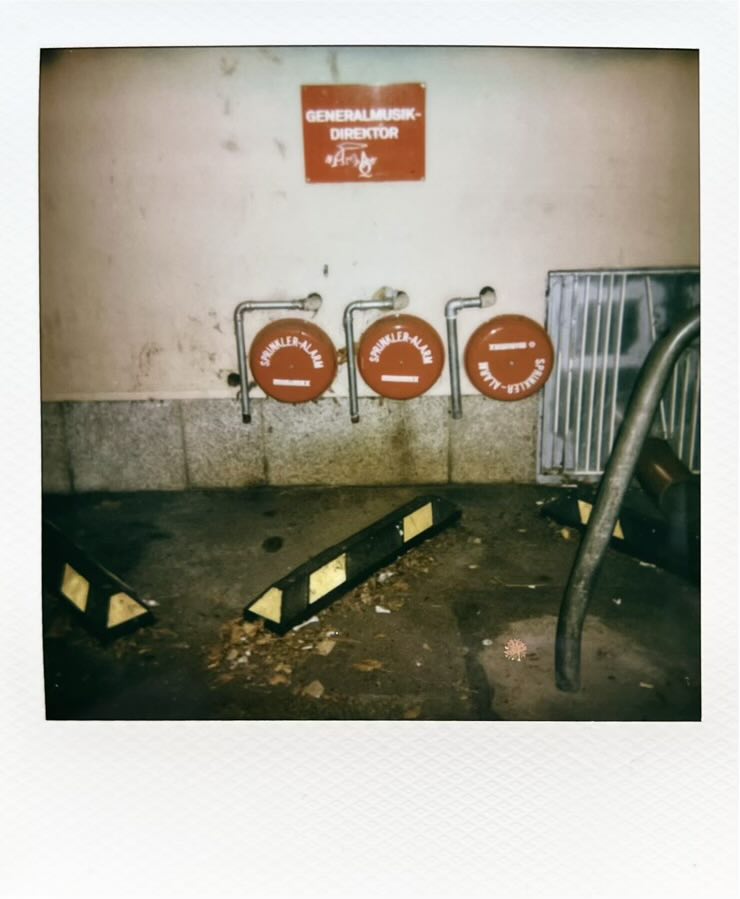 A parking lot with a sign saying Generalmusikdirektor.