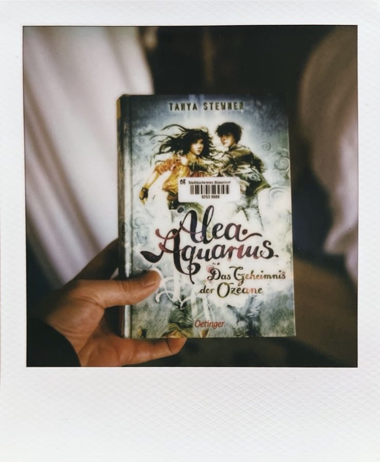 The book Alea Aquarius in my hand.