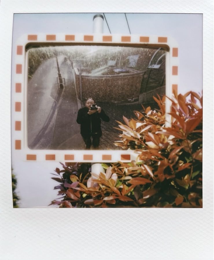 Me in a tight-corner mirror.