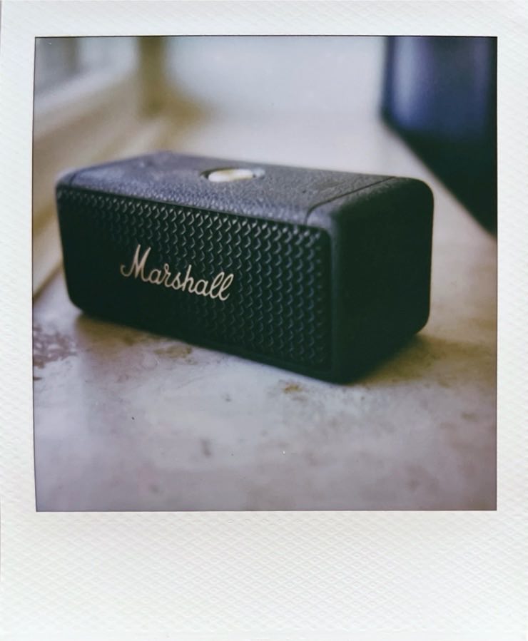 A little Marshall Emberton II speaker on a window sill.