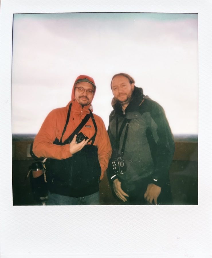 Florian and me in rain jackets on and cameras around our necks.